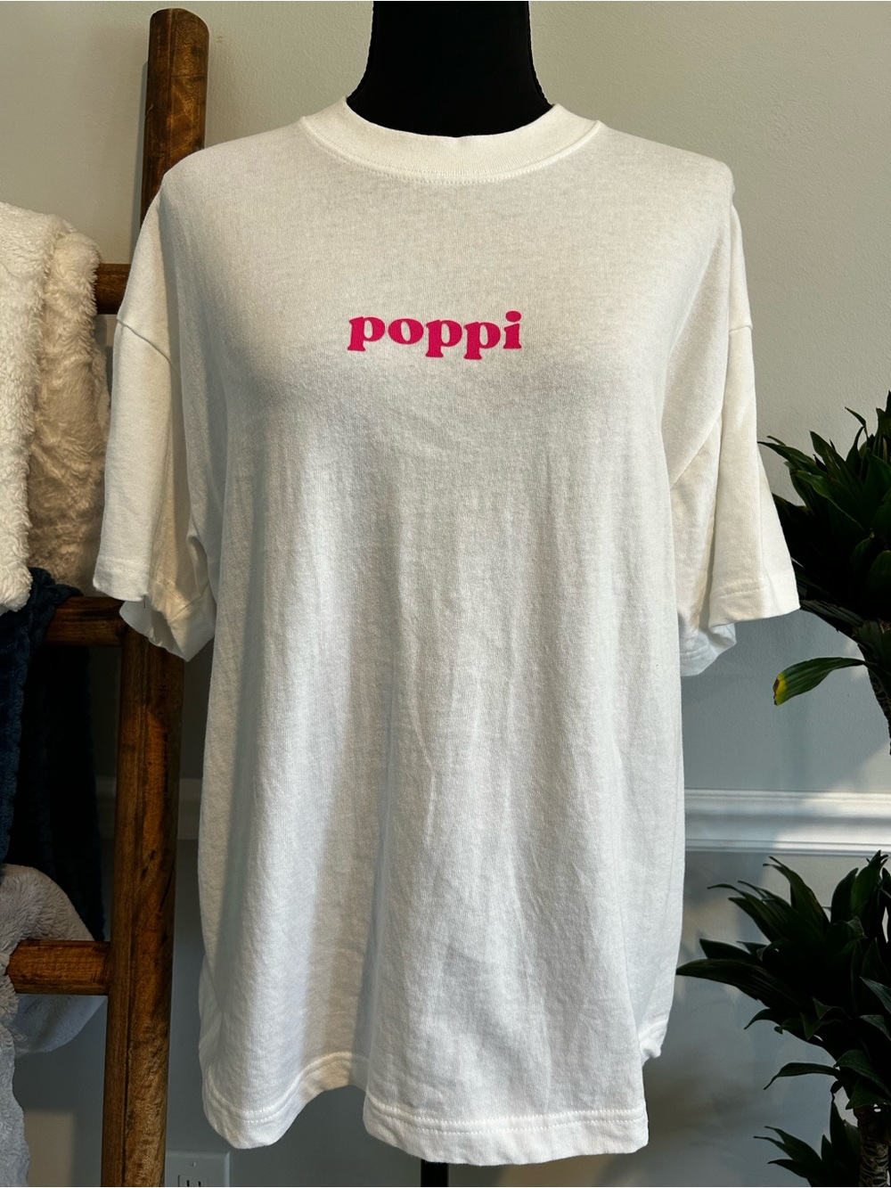 pop white tee with bright pink poppi logo size small